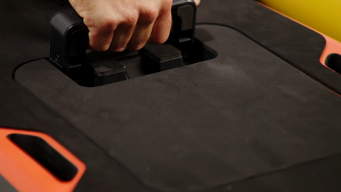 Person removing battery from eFoil