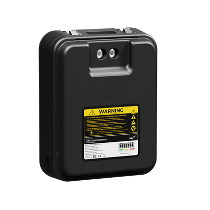 Black battery pack with warning label on a white background